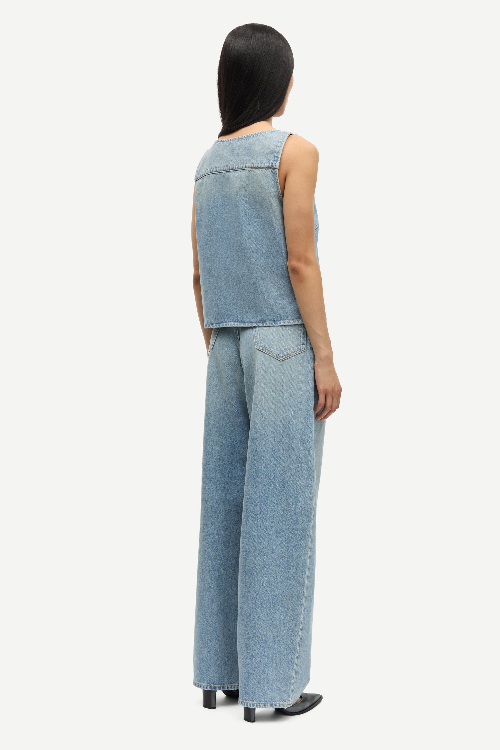 blue cotton tank top with belt detail on one shoulder and cut in a denim style rear view 