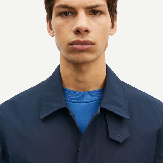 mens navy blue polyester longline coat with concealed placket close up