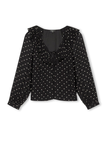 V neck black top with ruffled neck and polka dots