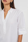 White short sleeve top with v neck, collar and boxy fit close up