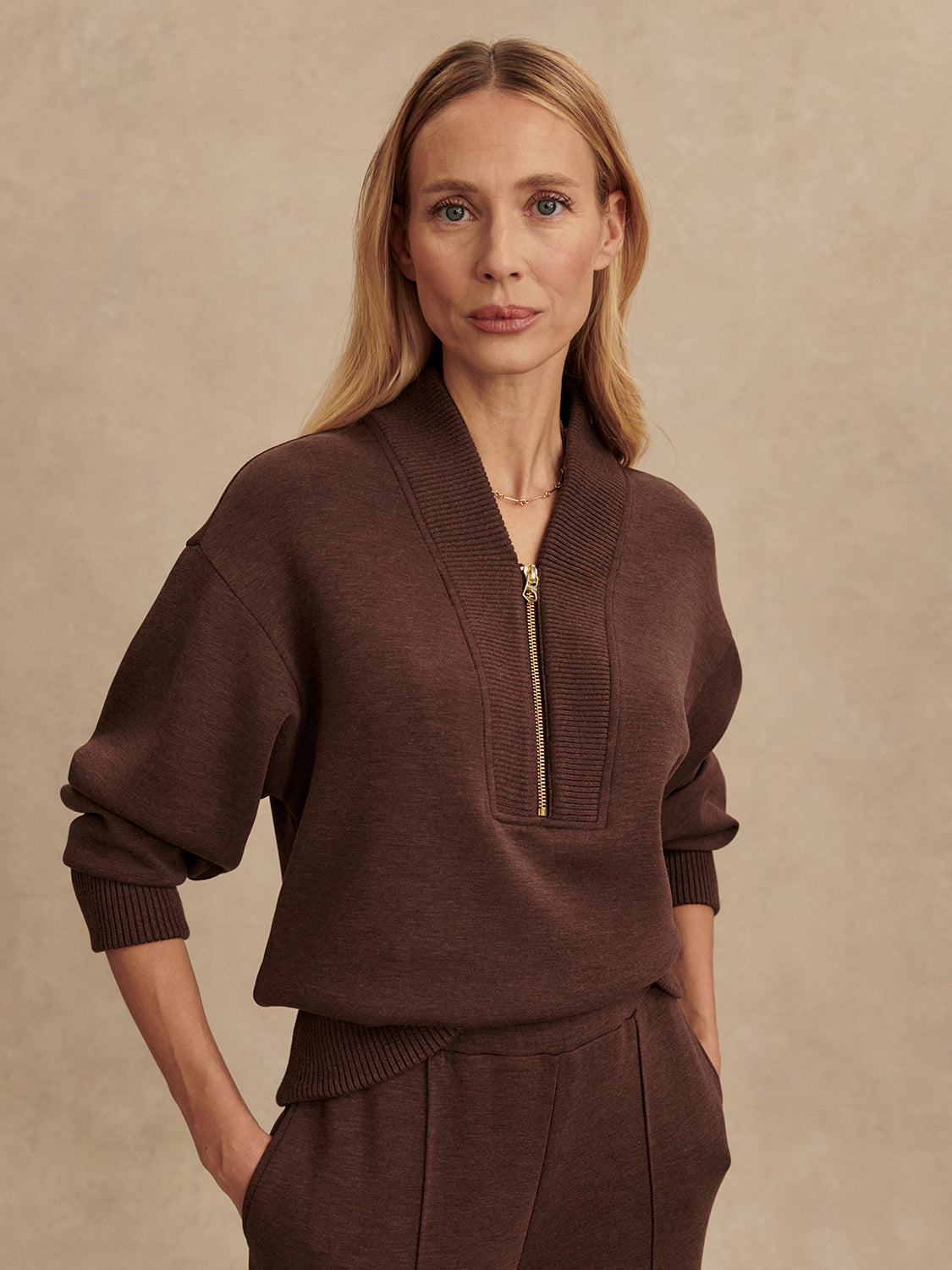 chocolate brown half zip jumper with dropped shoulder, rib detailing and gold zip