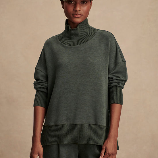 Olive green jumper with rib detailing and side zip