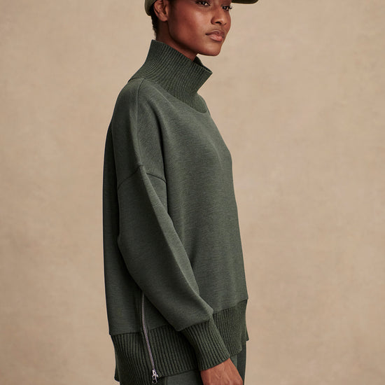Olive green jumper with rib detailing and side zip