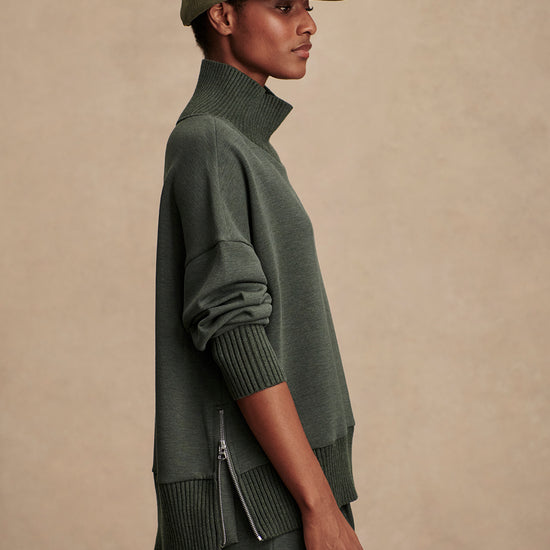 Olive green jumper with rib detailing and side zip side view
