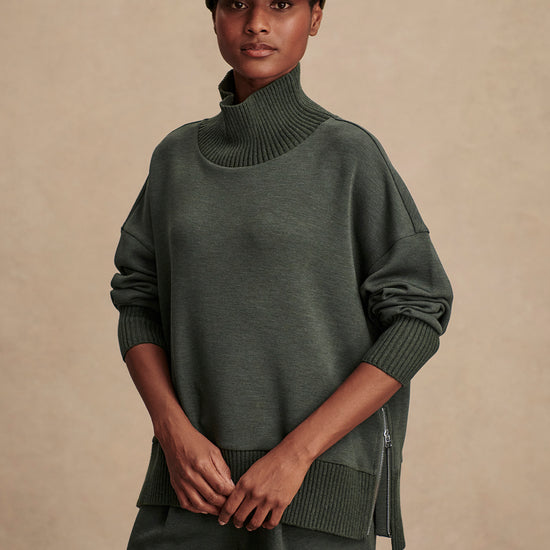 Olive green jumper with rib detailing and side zip