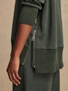 Olive green jumper with rib detailing and side zip close up