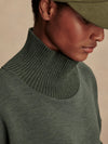Olive green jumper with rib detailing and side zip close up