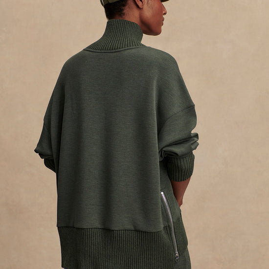 Olive green jumper with rib detailing and side zip rear view