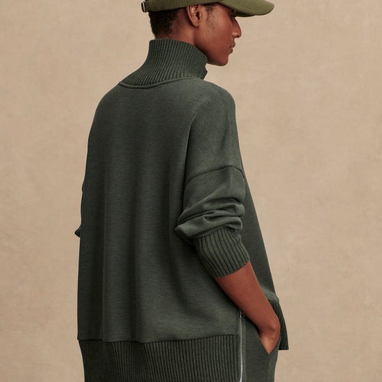 Olive green jumper with rib detailing and side zip rear view