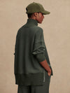 Olive green jumper with rib detailing and side zip rear view