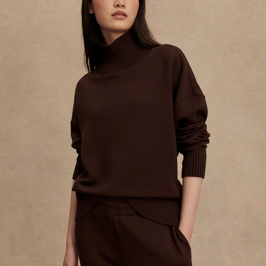 brown jumper with rib detailing and side zip model shot from Varley