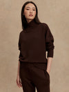 brown jumper with rib detailing and side zip model shot from Varley