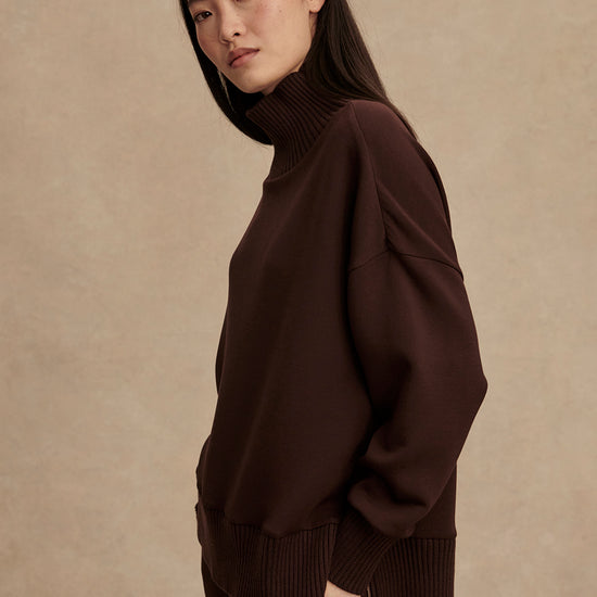 brown jumper with rib detailing and side zip side view from Varley