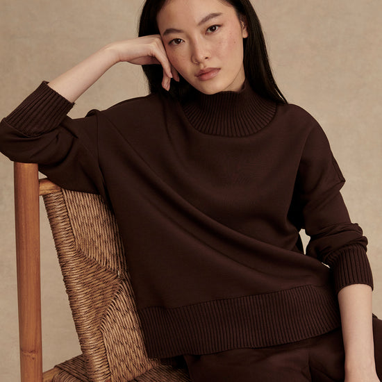 brown jumper with rib detailing and side zip model shot