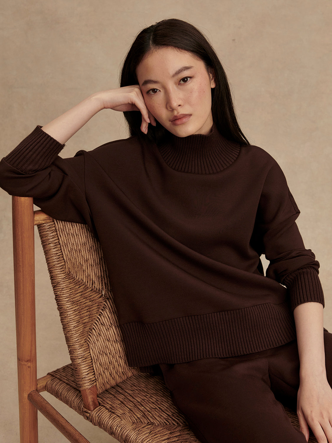 brown jumper with rib detailing and side zip model shot
