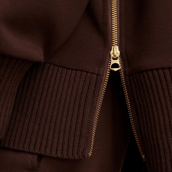 brown jumper with rib detailing and side zip close up of zip from Varley