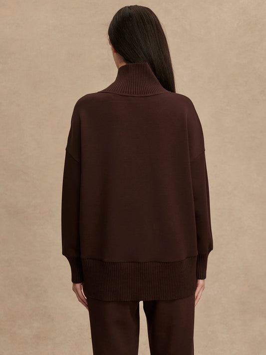 brown jumper with rib detailing and side zip rear view from Varley