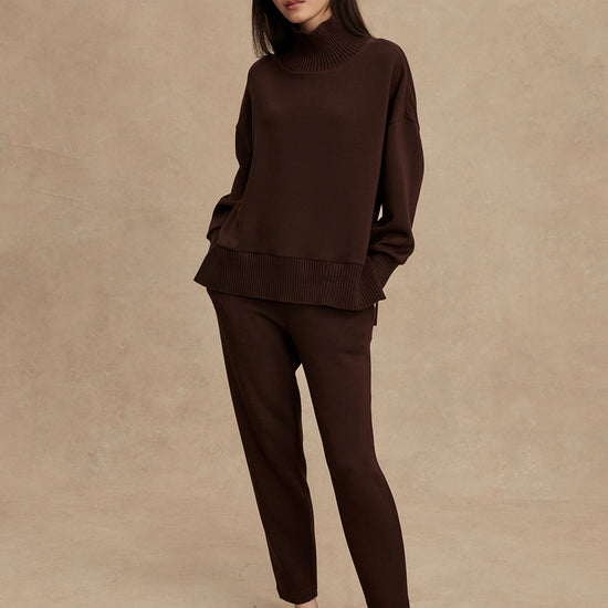 brown jumper with rib detailing and side zip model shot