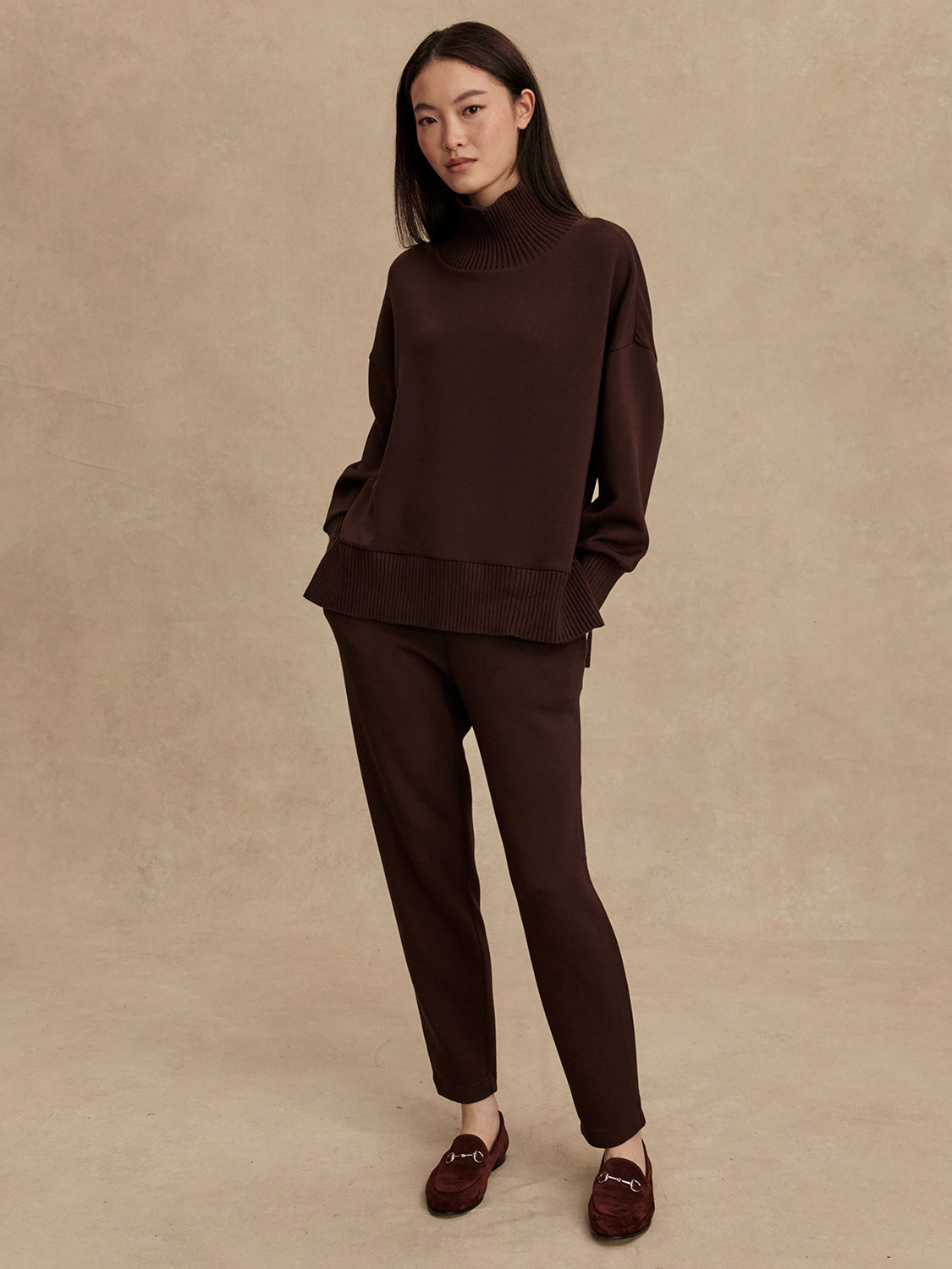 brown jumper with rib detailing and side zip model shot