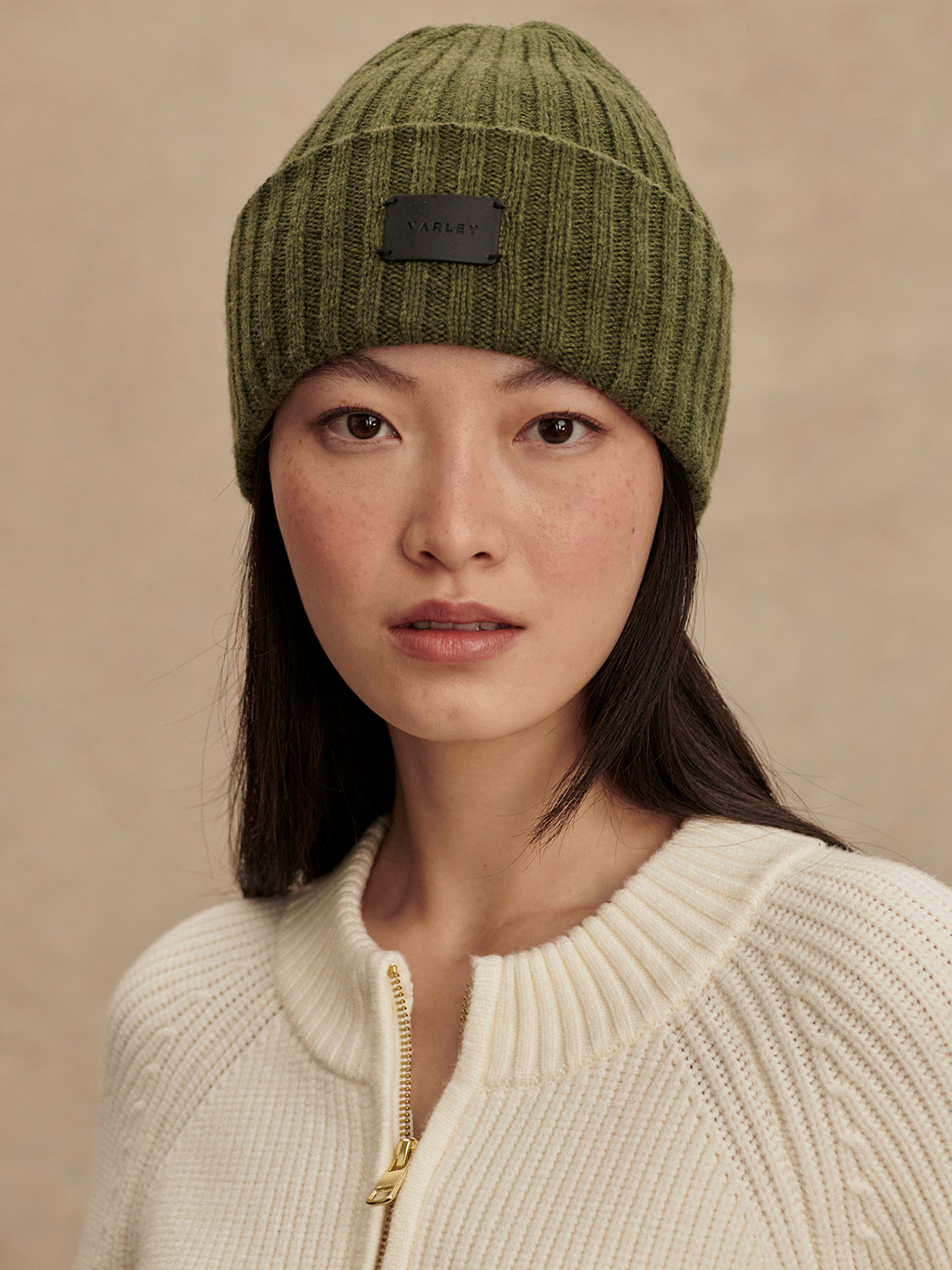 Olive green rib beanie with fold over and varley logo model shot