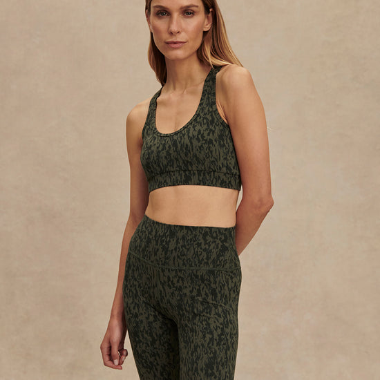 green pattern workout bra with racerback model shot