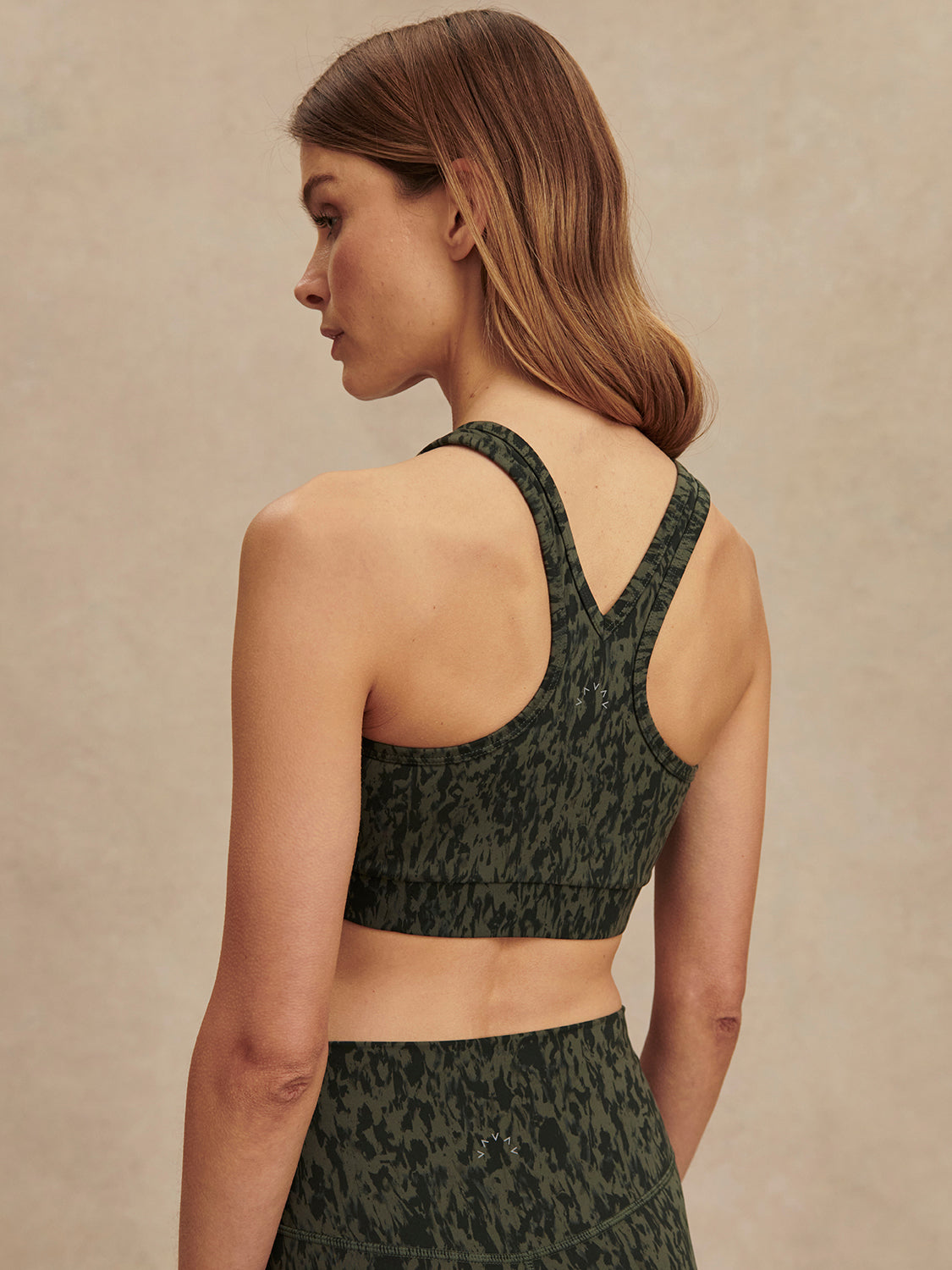 green pattern workout bra with racerback rear view 