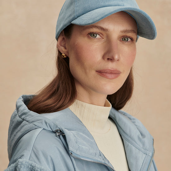 light blue baseball cal with adjustable tab at rear