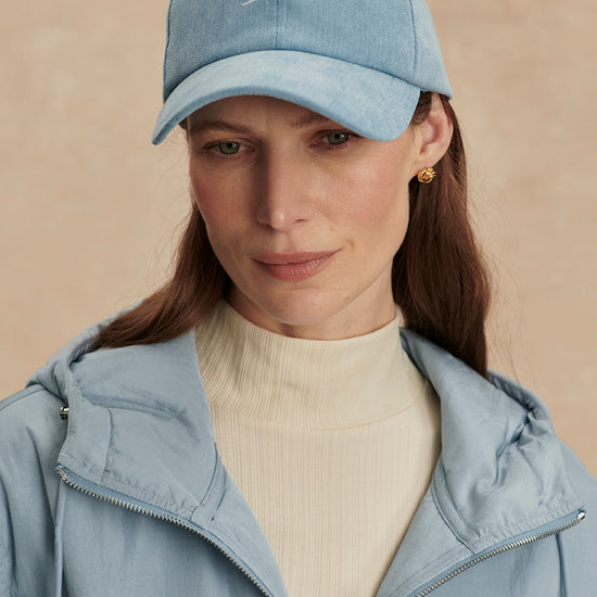 light blue baseball cal with adjustable tab at rear model shot