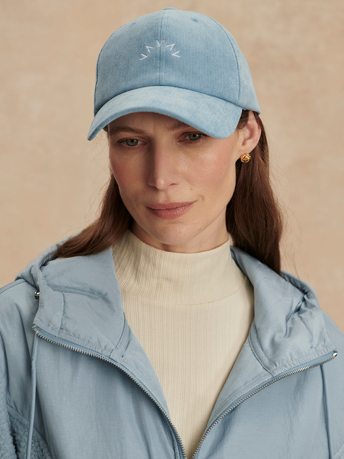 light blue baseball cal with adjustable tab at rear model shot