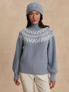 blue ribbed jumper with white varley logo and high neck model shot