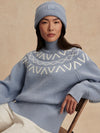 blue ribbed jumper with white varley logo and high neck model shot