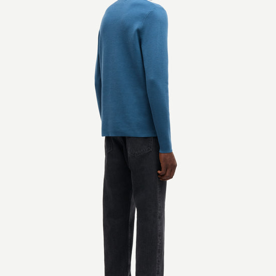 Blue long-sleeve polo shirt with a half zipped placket and relaxed fit rear view 