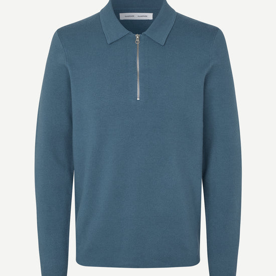 Blue long-sleeve polo shirt with a half zipped placket and relaxed fit