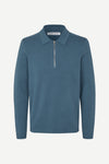 Blue long-sleeve polo shirt with a half zipped placket and relaxed fit