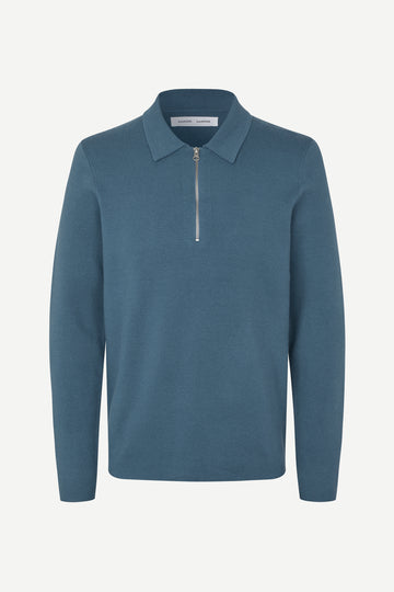 Blue long-sleeve polo shirt with a half zipped placket and relaxed fit