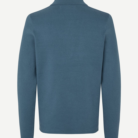 Blue long-sleeve polo shirt with a half zipped placket and relaxed fit rear view