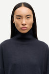 navy blue turtleneck cashmere jumper close up