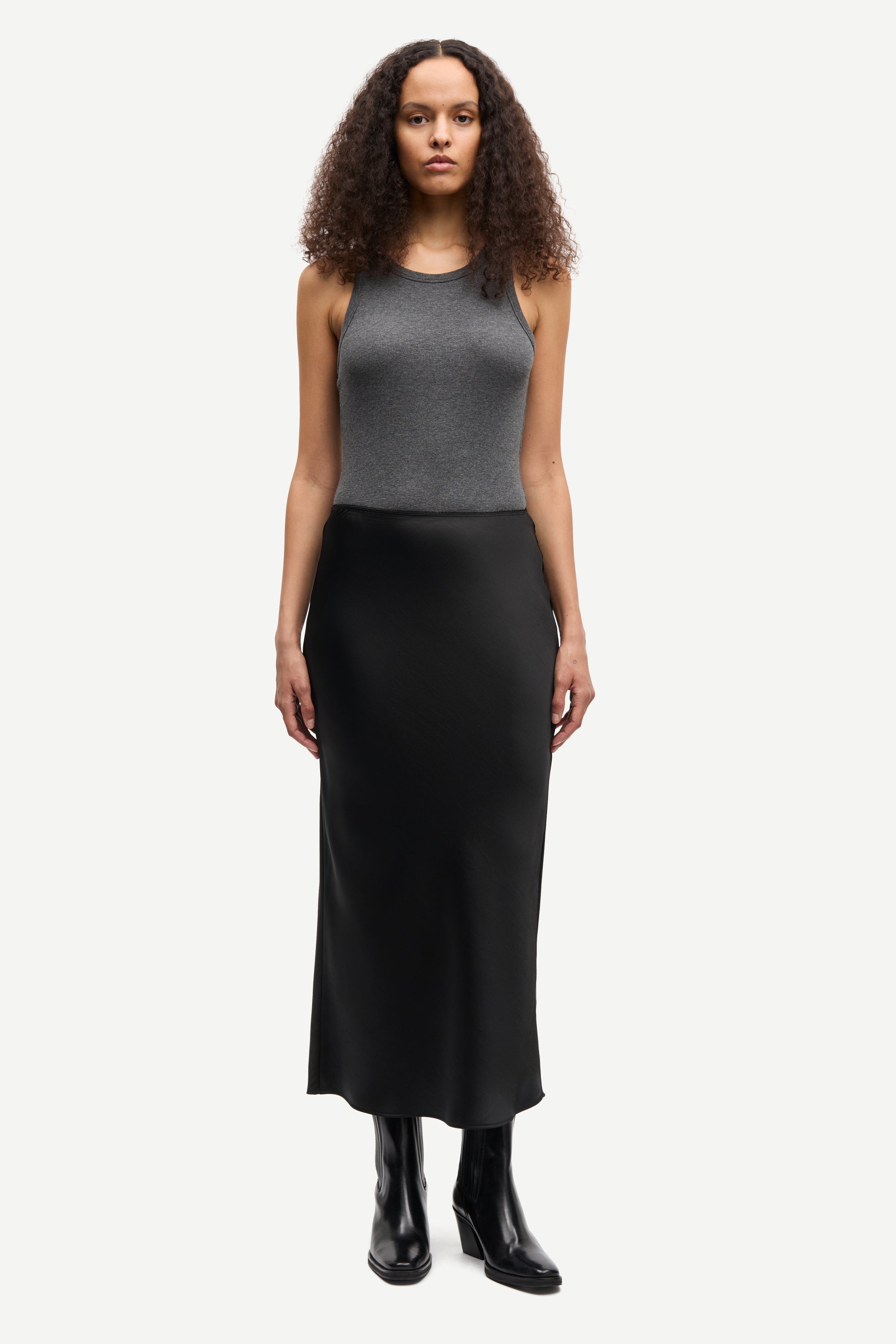 long satin black skirt with elasticated waistband and cut on the bias model shot