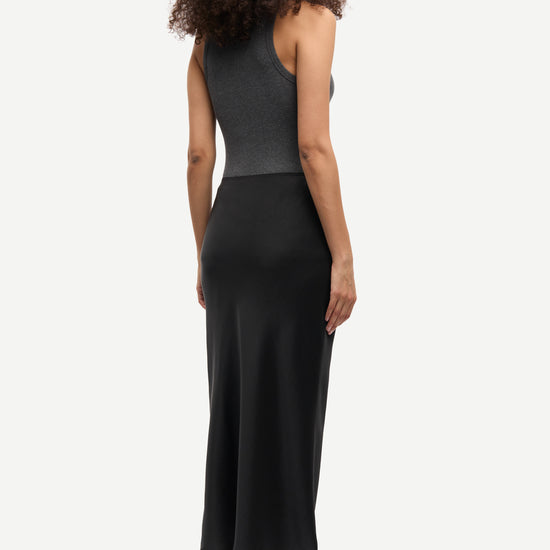 long satin black skirt with elasticated waistband and cut on the bias rear view model shot