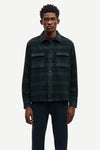 navy and green check overshirt with 2 chest patch pockets and buttoned cuffs from samsoe samsoe model shot
