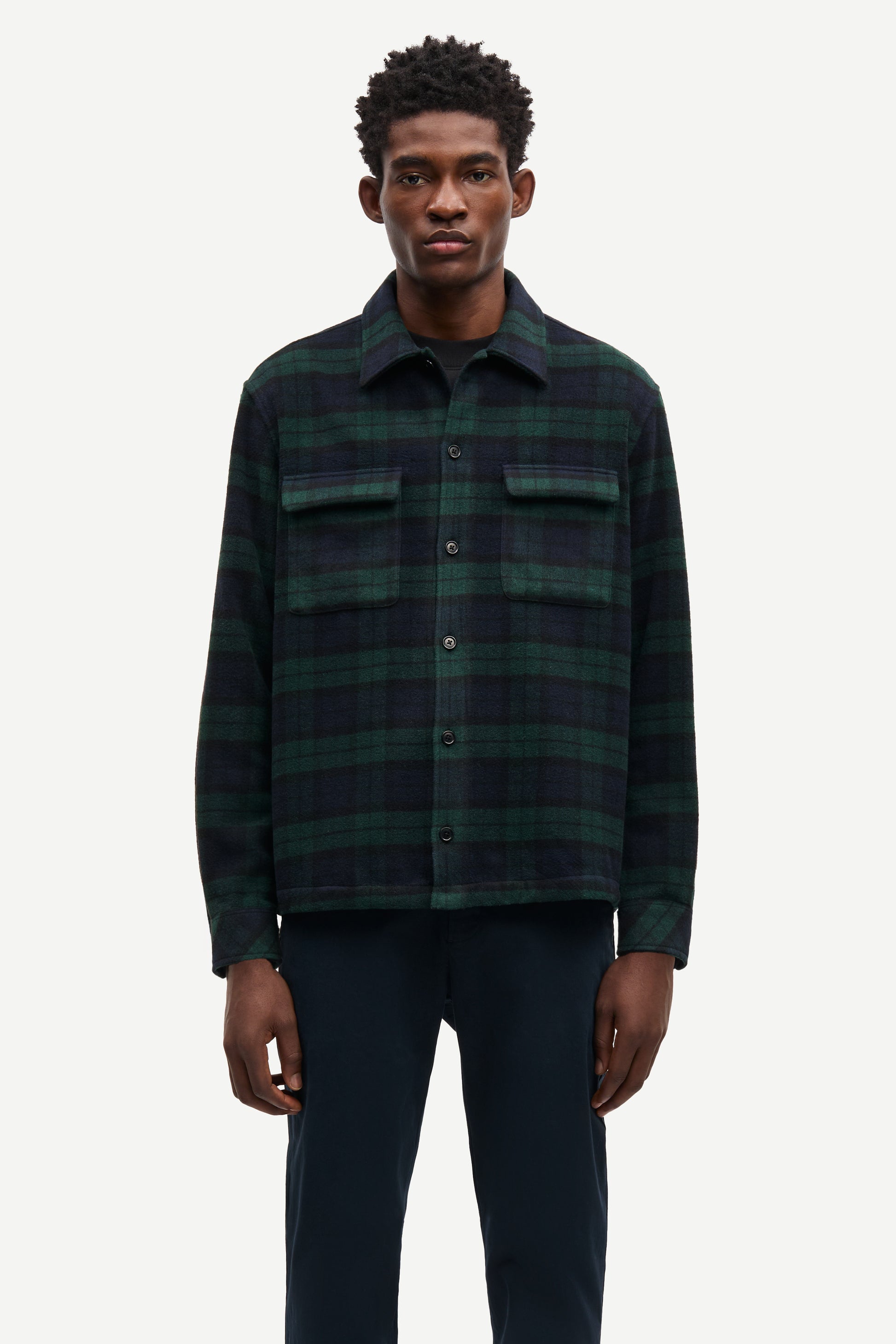 navy and green check overshirt with 2 chest patch pockets and buttoned cuffs from samsoe samsoe model shot