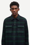 navy and green check overshirt with 2 chest patch pockets and buttoned cuffs from samsoe samsoe model shot