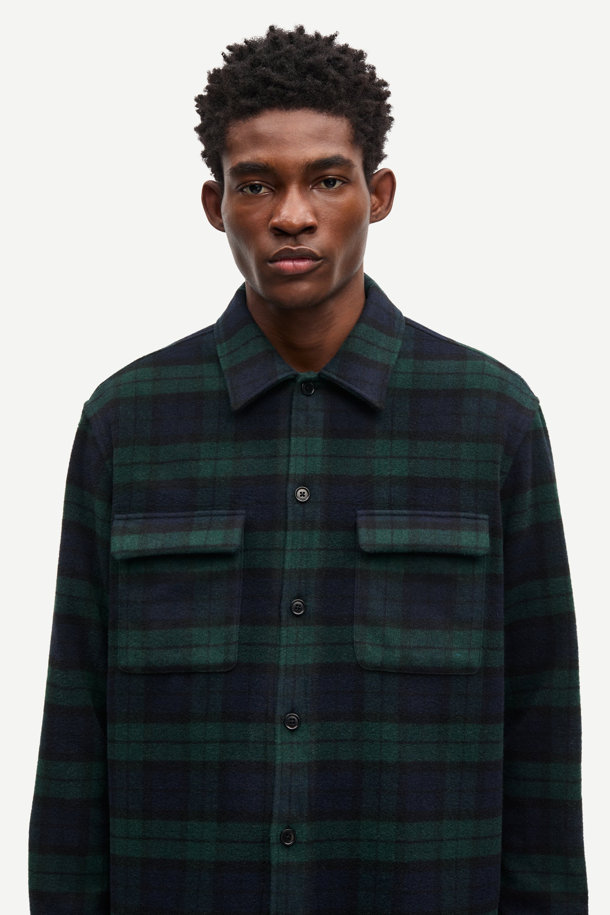 navy and green check overshirt with 2 chest patch pockets and buttoned cuffs from samsoe samsoe model shot