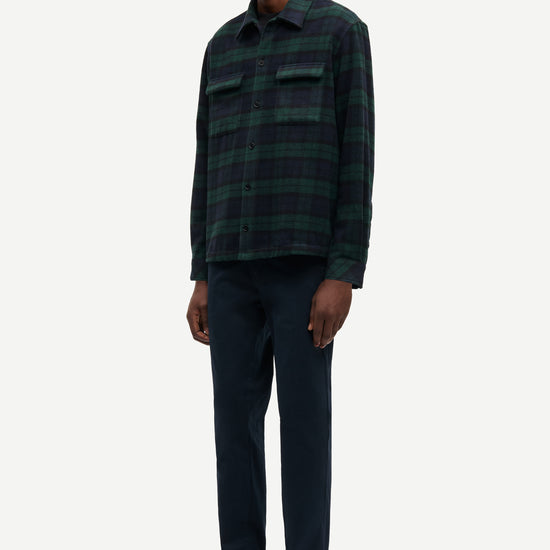 navy and green check overshirt with 2 chest patch pockets and buttoned cuffs from samsoe samsoe model shot