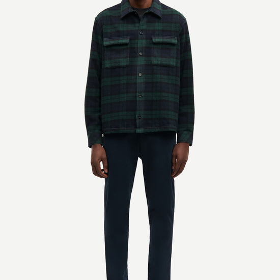navy and green check overshirt with 2 chest patch pockets and buttoned cuffs from samsoe samsoe model shot