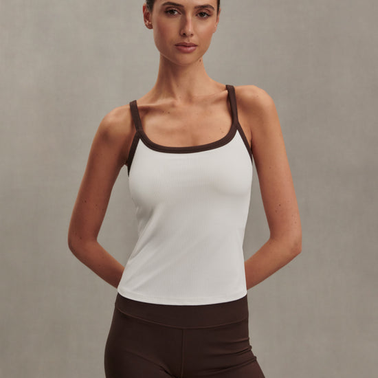 white ribbed tank top with chocolate brown straps/edging from varley model shot