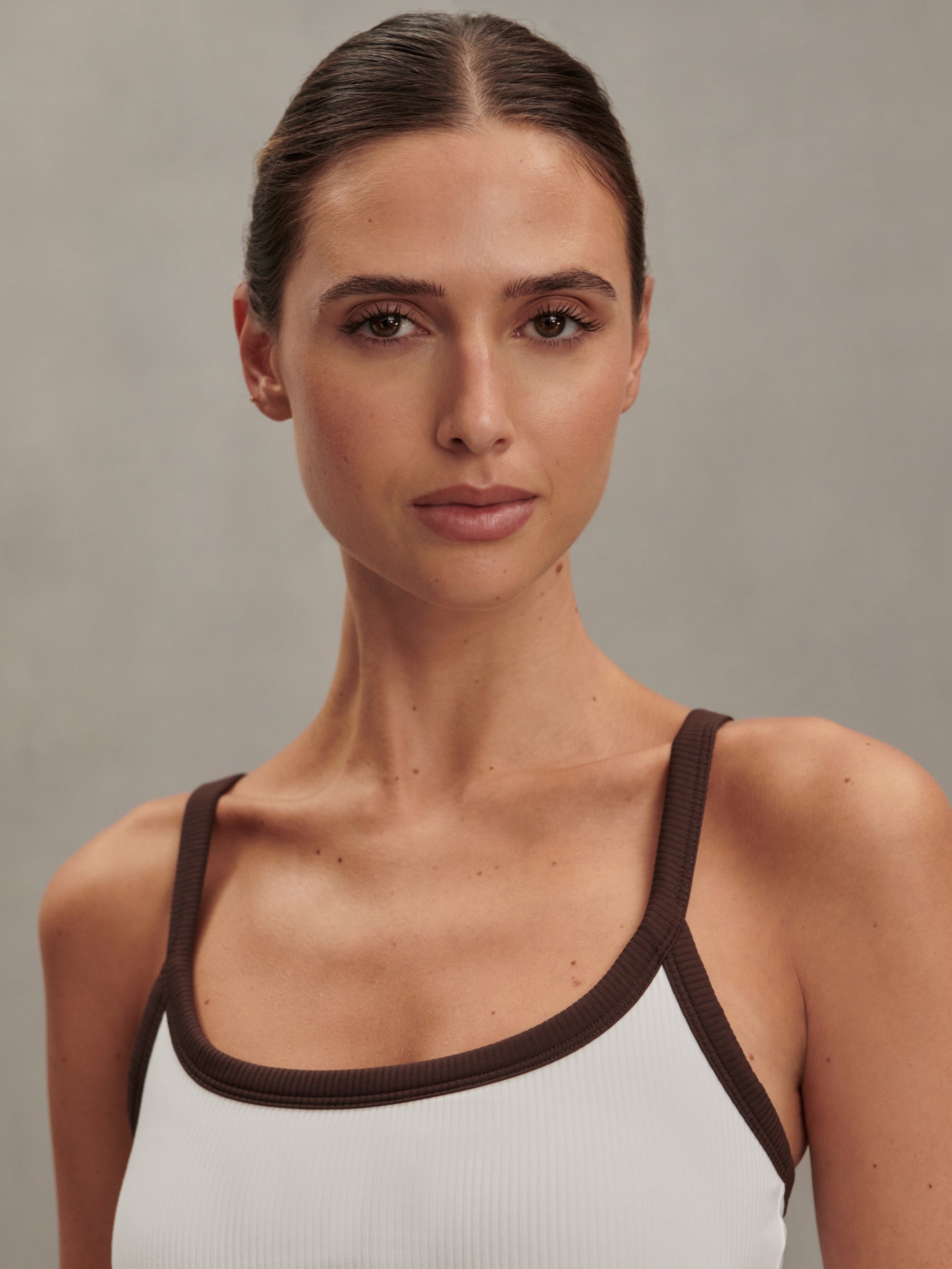 white ribbed tank top with chocolate brown straps/edging from varley close up