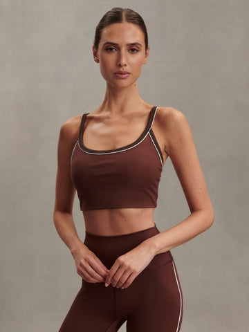 brown sports bra with white piping form varley