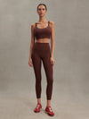brown sports bra with white piping form varley MODEL SHOT