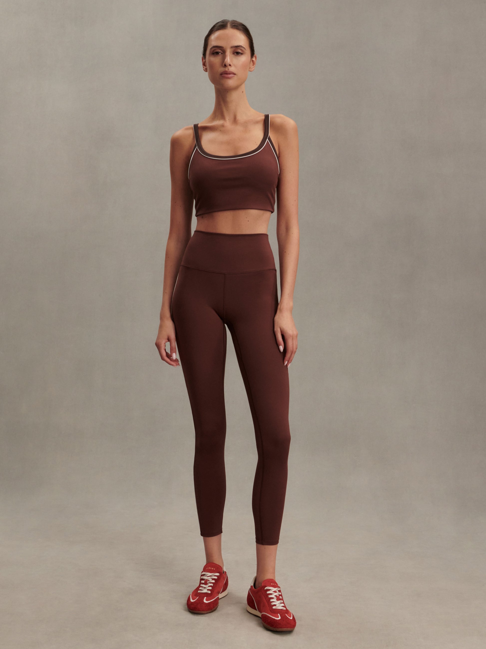 brown sports bra with white piping form varley MODEL SHOT